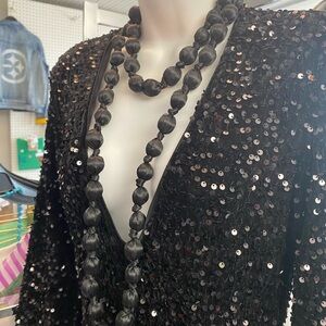 Rhinestone Jumpsuit w/ black beaded necklace bell bottom flare.